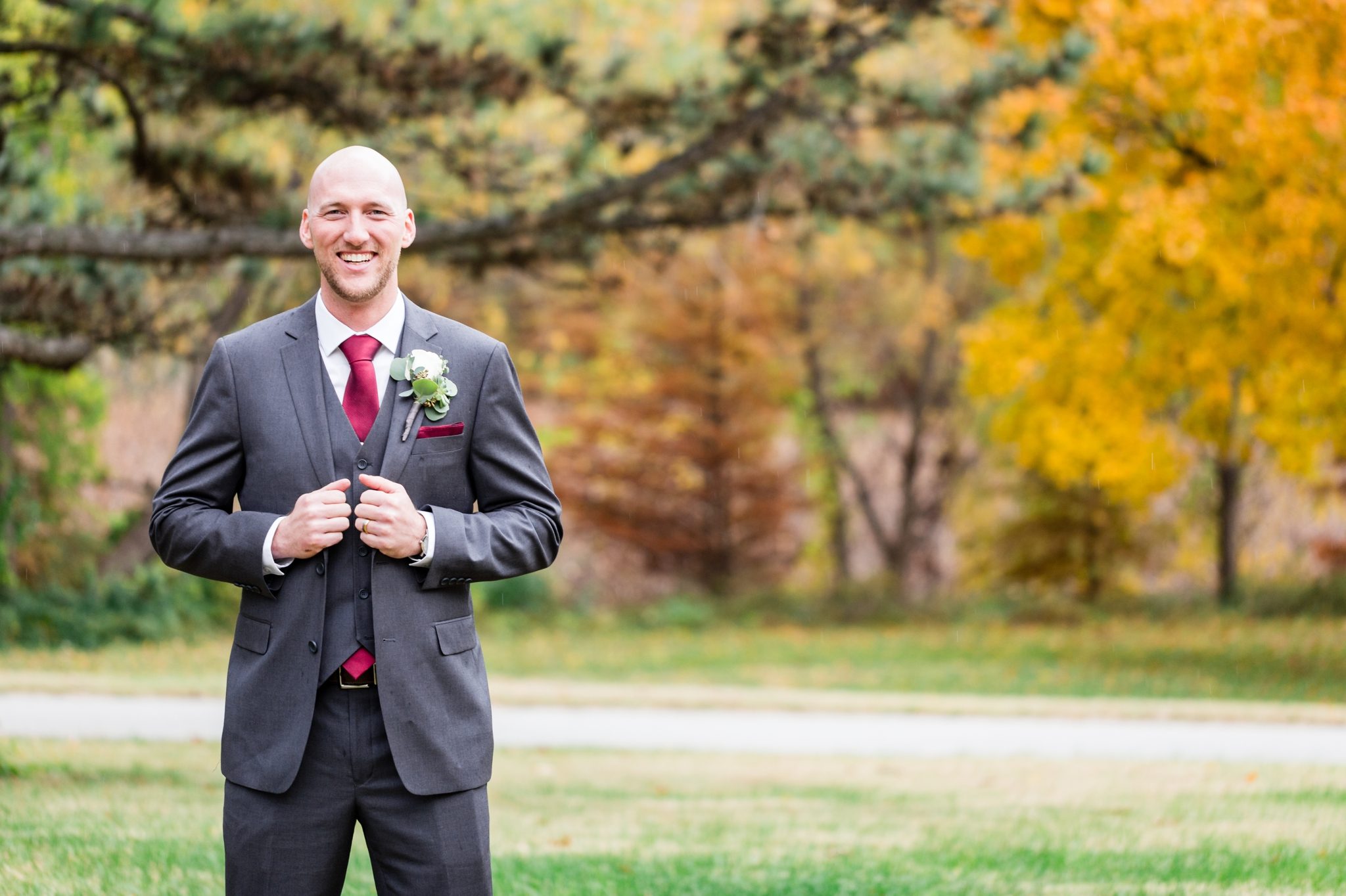 groom portrait in gray suit, burgandy tie